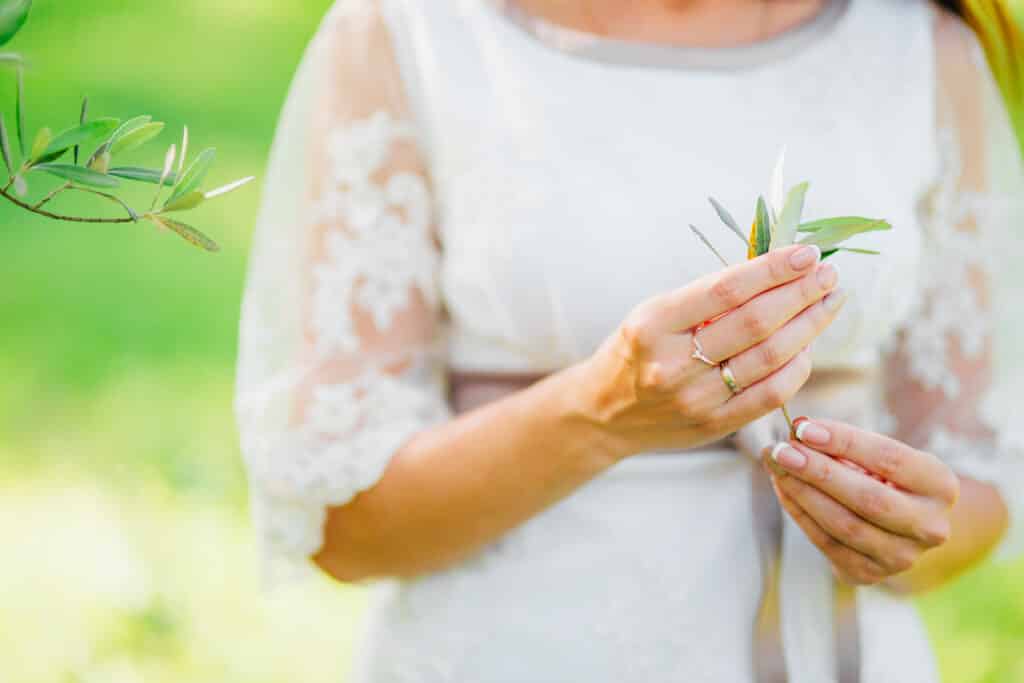 olive branch female hands hands bride wedding mon