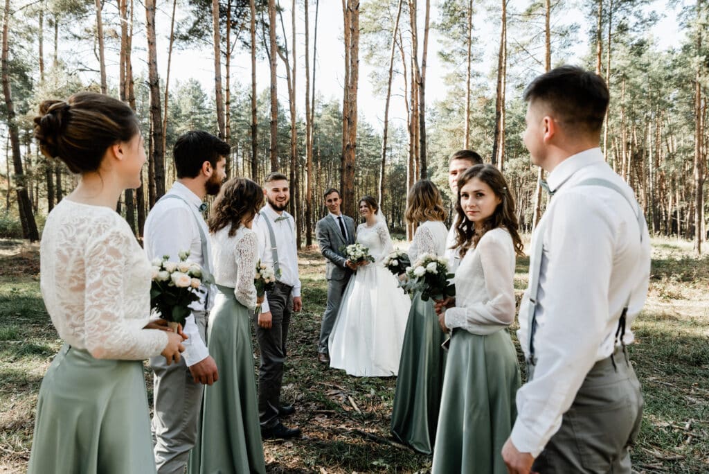 bride groom their friends are having fun hugging